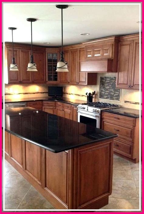 white oak cabinets black granite countertops stainless steel appliances|black and white countertops.